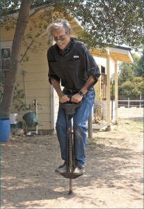 Good riding requires centering one's balance. Photographer Dick Wood practices centering his balance on the pogo-stick!